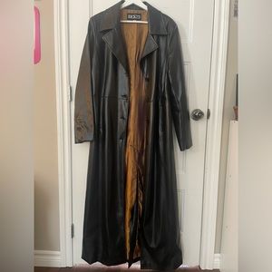 Ricki’s long black faux leather jacket